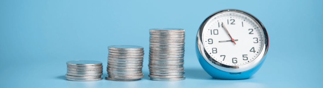 clock and piles of coins symbolise time saved by finance employee